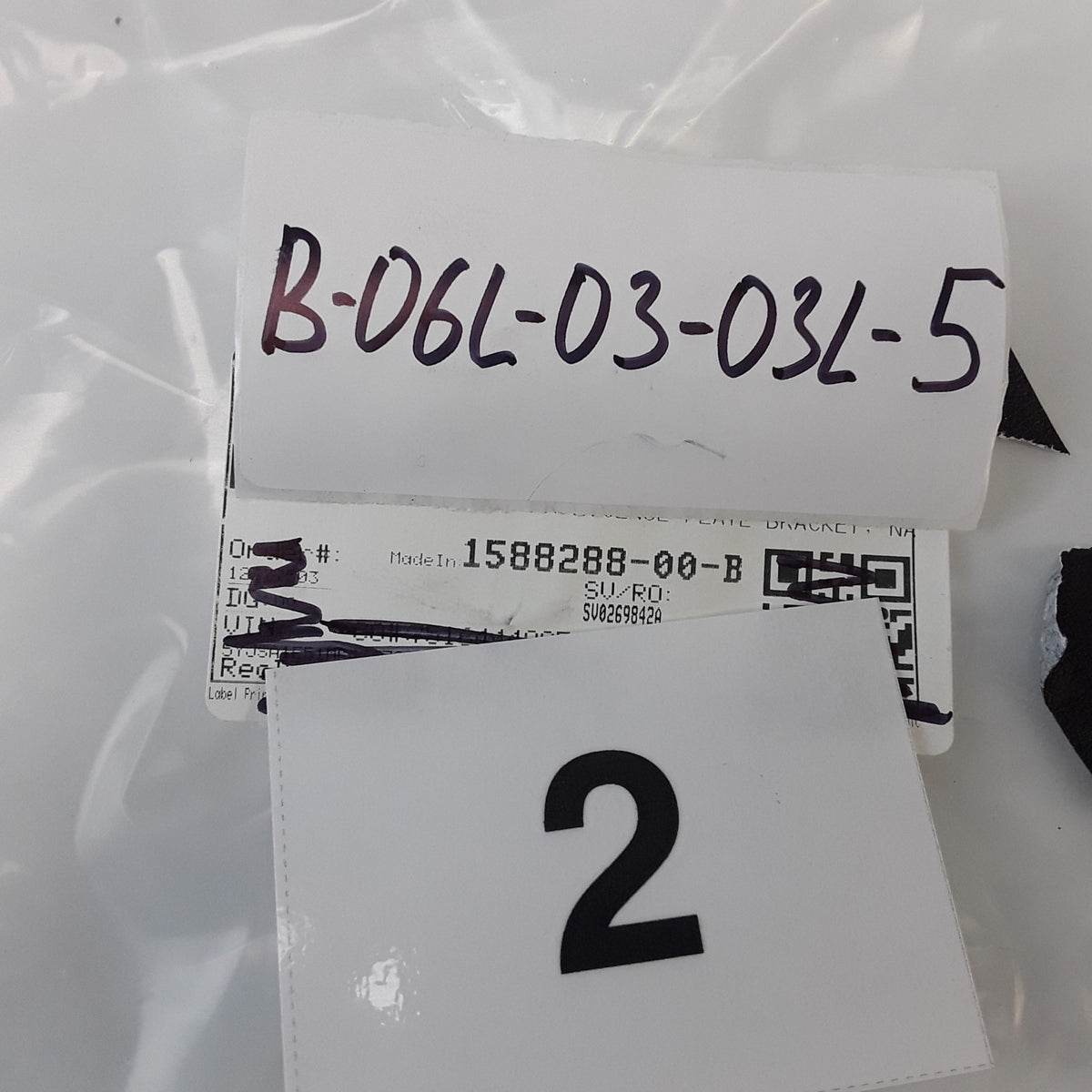 1588288-00-B Front License Plate Bracket Molding For Tesla Model S 2021-2025 OEM