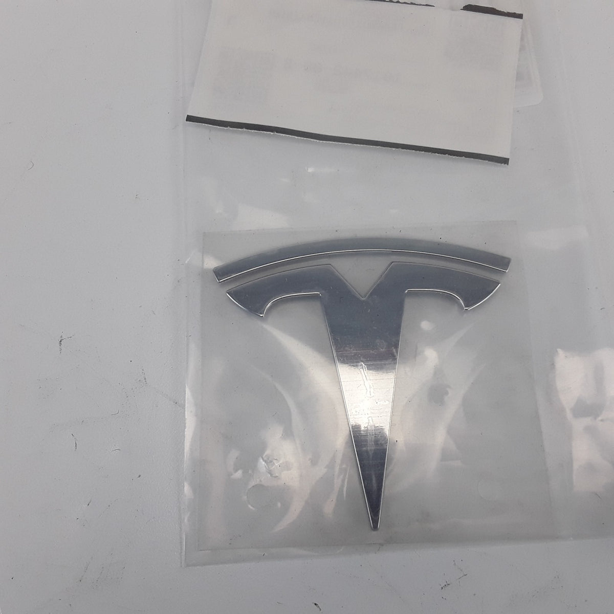 Model S 2012-2016 Front Tesla T Badge 1017442-00-B Genuine OEM