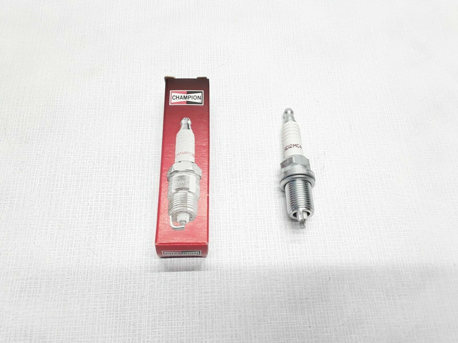 Champion 318 RC12MC4 Outlander Sport Yaris Lancer Resistor Copper Spark Plug - HotCarParts